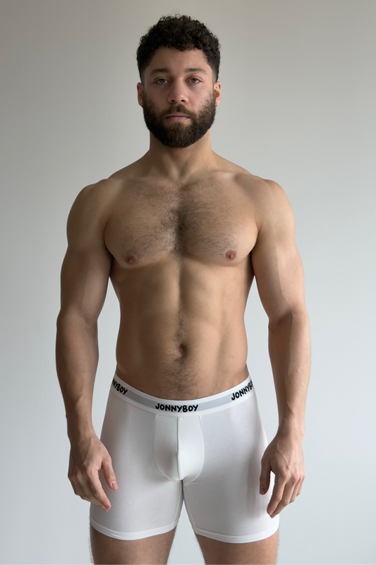 Man wearing white boxer briefs with 'JONNYBOY' branding against a plain background